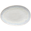 Round ceramic plate with gold rim on a white background