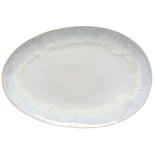 Round ceramic plate with gold rim on a white background