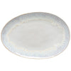 Round ceramic plate with gold rim on a white background