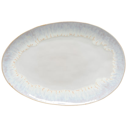 Round ceramic plate with gold rim on a white background